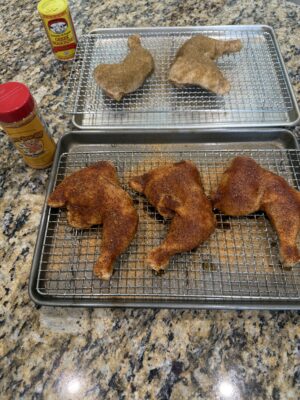 Chicken Leg/Thigh Quarters resting after having rub applied.