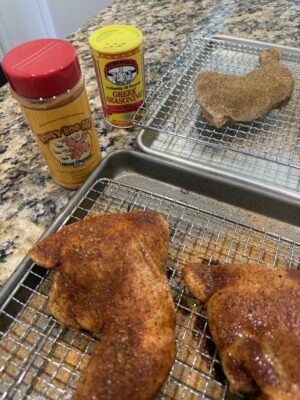 Chicken Leg/Thigh Quarters resting after having rub applied. Rubs are Meat Church Honey Hog and Konriko Greek Seasoning.